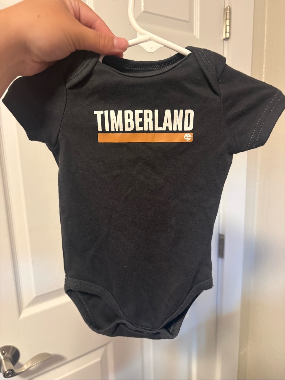 Timberland Black Onesie with Gold Stripe